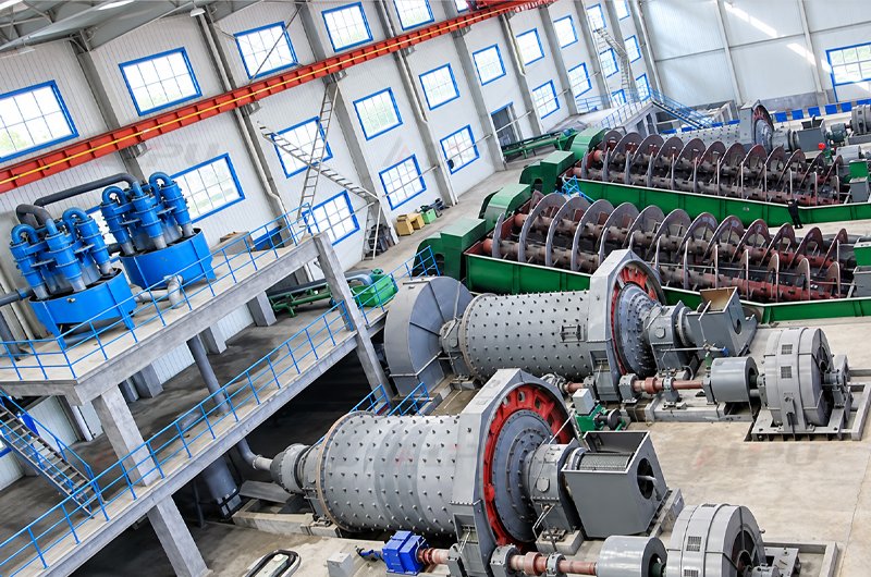 Hydrocyclone cluster installed on elevated platform for closed grinding circuit classification alongside industrial ball mills