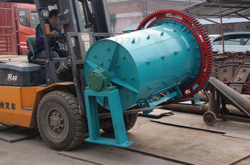 Batch ball mill being moved by forklift in the factory