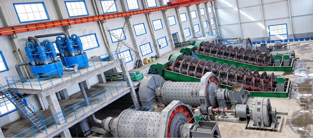 Two-stage closed-circuit grinding and classification plant with overflow ball mills and elevated hydrocyclone clusters for cobalt ore.