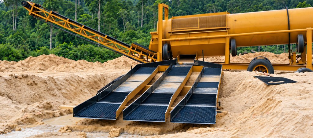 Washing and screening equipment preparing alluvial mineral feed for gravity separation.