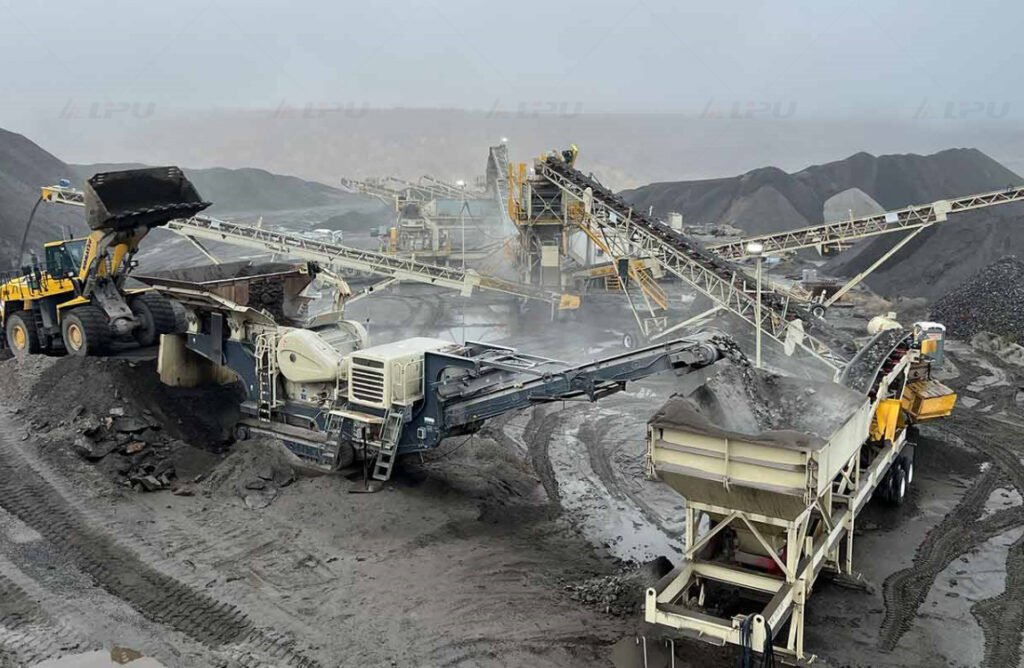 Crawler mobile crusher processing hard mining ore at an open-pit mine site