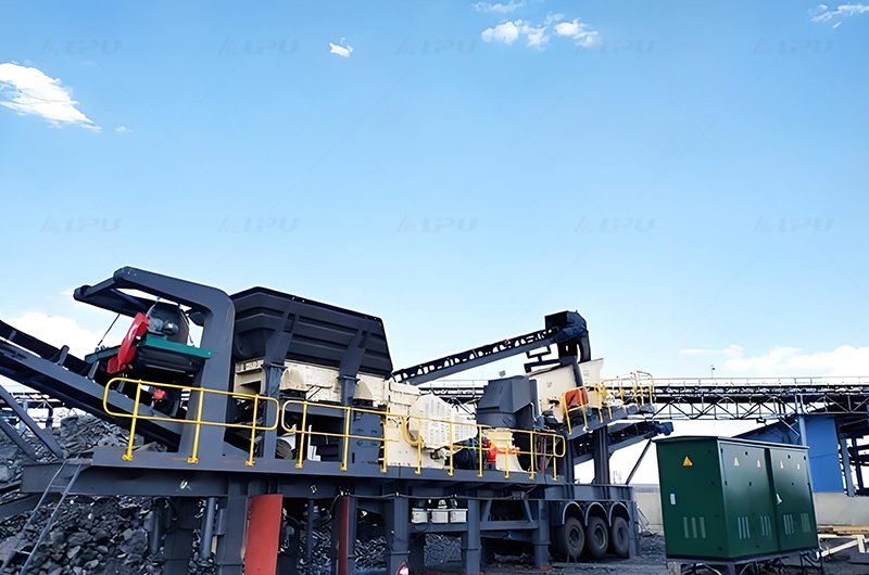 Wheel-mounted crushing and screening plant operating at an aggregate processing site