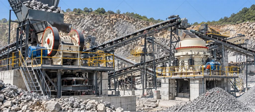 Real primary jaw crusher and secondary cone crusher installations used for staged reduction of hard rock ore.