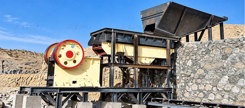 Run-of-mine ore receiving hopper and vibrating grizzly feeder supplying material to a primary crushing station.