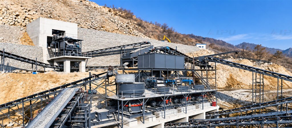 Mineral processing crushing plant with ore receiving hopper, primary crusher, and conveyors preparing run-of-mine ore for grinding.