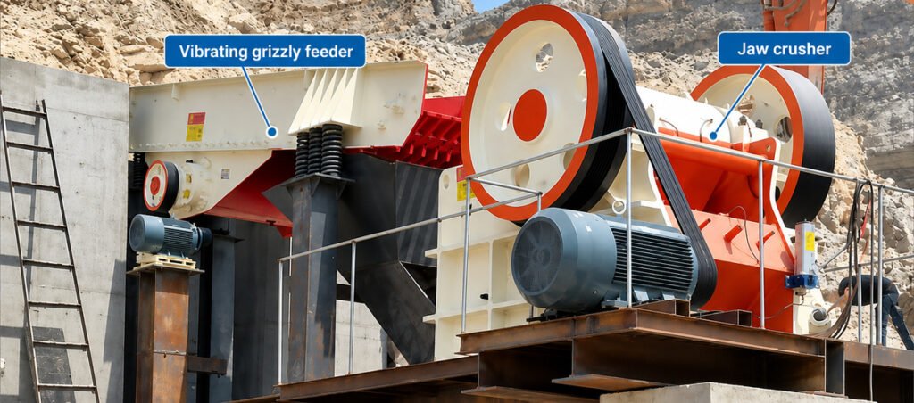 Industrial crushing plant showing a vibrating grizzly feeder connected to a primary jaw crusher.